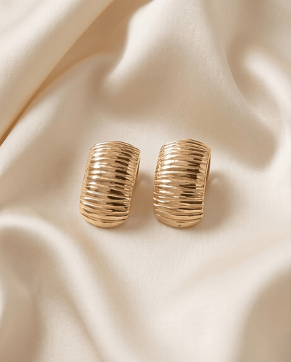 14K gold drop earrings close-up showing polished gold details and delicate craftsmanship, Chrysus Golds